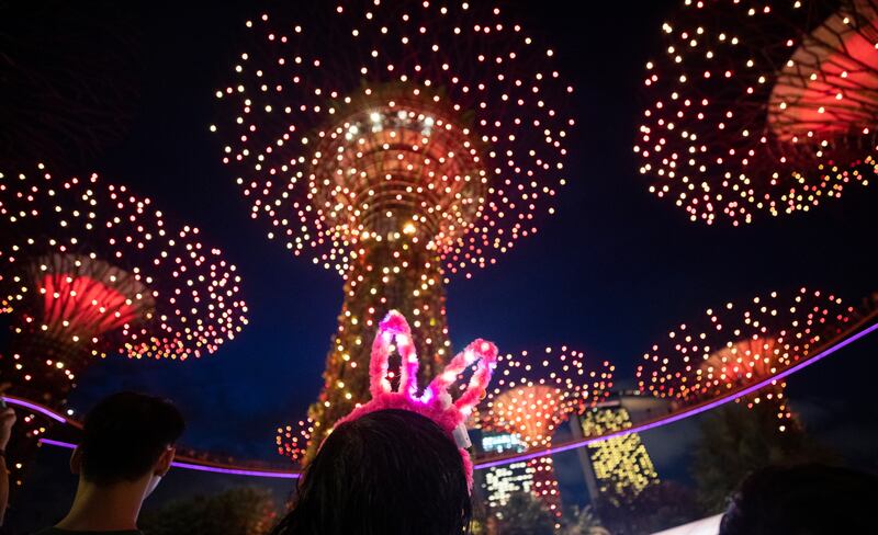 A woman wears rabbit ears to celebrate the year of the rabbit at the River Hongbao festival in Singapore. EPA