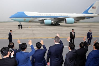 Officials wave at Air Force One as US President Donald J. Trump leaves from Nom Bar International Airport in Hanoi. EPA