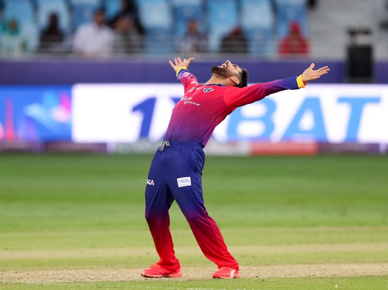 Dubai Capitals' Sikandar Raza after taking the wicket of Abu Dhabi Knight Riders' Sunil Narine in their ILT20 match. Chris Whiteoak / The National