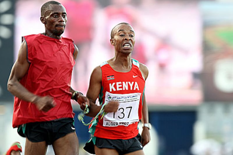 Henry Wanyoike, right, with his guide races to win the 5,000m silver medal at the ninth All-Africa Games in 2007.