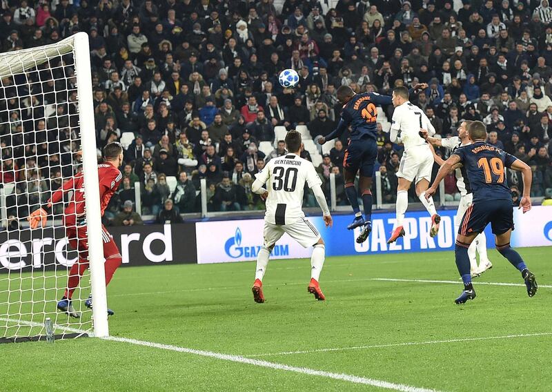 Valencia's Mouctar Diakhaby, centre, in action during the Uefa Champions League Group H match against Juventus  at the Allianz Stadium in Turin. EPA