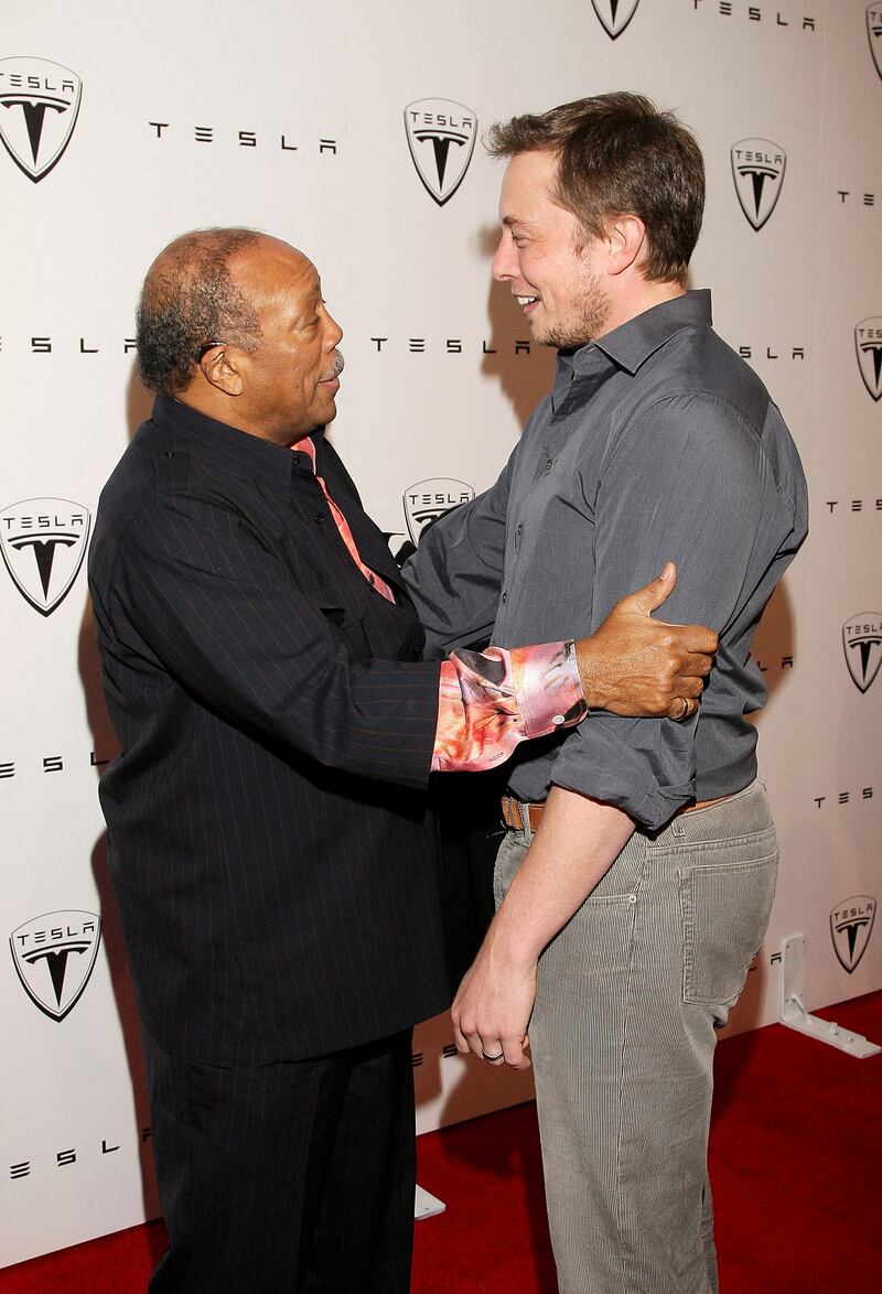 Mr Musk with music producer Quincy Jones at the Tesla Roadster launch party in 2008 AFP