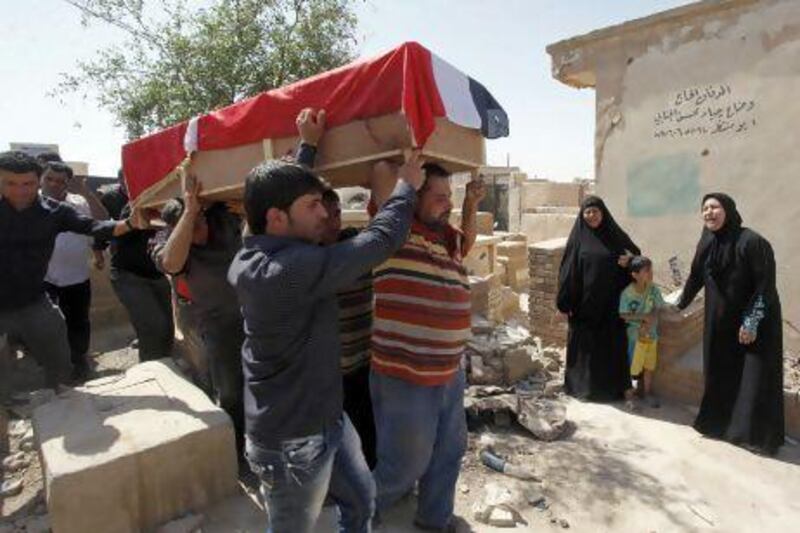 A 28-year-old bombing victim, Bashar Muhsin, is taken for burial in Najaf.