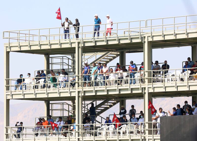 Nepalese fans cheers on their team during the ICC World T20 Global Qualifier in Muscat.