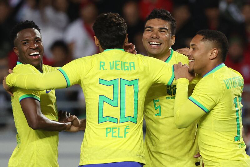 Brazil midfielder Casemiro, second right, celebrates with teammates after scoring. AFP