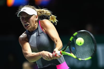 SINGAPORE - OCTOBER 23:  Caroline Wozniacki of Denmark plays a backhand in her singles match against Elina Svitolina of Ukraine during day 2 of the BNP Paribas WTA Finals Singapore presented by SC Global at Singapore Sports Hub on October 23, 2017 in Singapore.  (Photo by Clive Brunskill/Getty Images)
