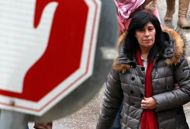 TOPSHOT - Popular Front for the Liberation of Palestine (PFLP) member Khalida Jarrar, 56, walks following her release from an Israeli jail on February 28, 2019, Nablus in the occupied West Bank. Israel released from custody the Palestinian politician who had been held without trial for 20 months over links to an organisation it considers a terrorist group, the Israeli prison service said. She was arrested on July 2, 2017 for being a senior member in the PFLP, a movement considered a terrorist organisation by Israel, the United States and the European Union. / AFP / JAAFAR ASHTIYEH
