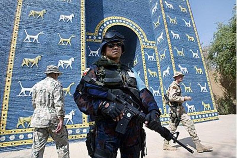 A military policeman stands guard outside a replica of the Ishtar Gate in Sept 2003. The gate, the eighth around the ancient city of Babylon, was originally built in 575BC by order of King Nebuchadnezzar II.