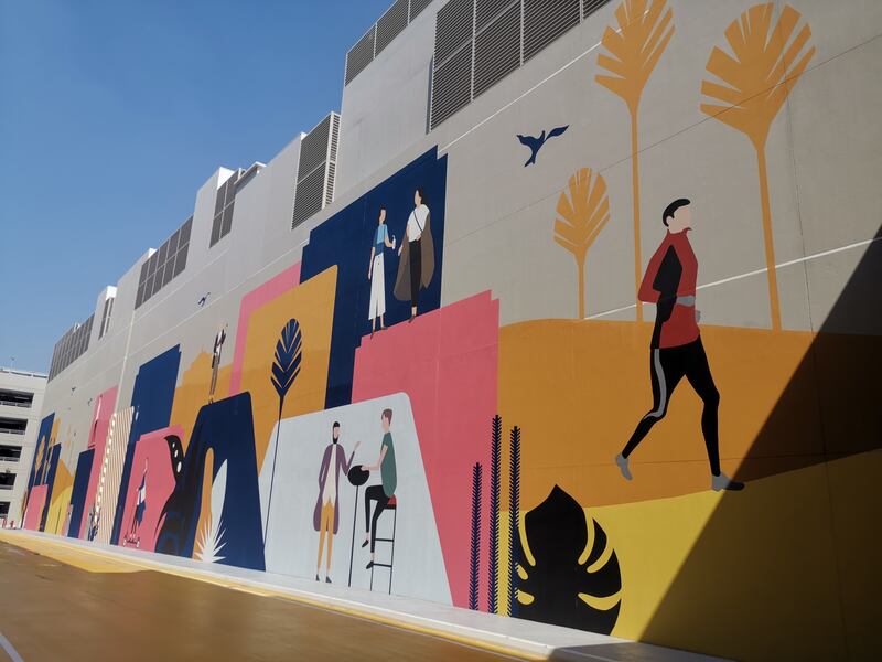 Murals are painted on the external walls of Dubai Hills Mall.