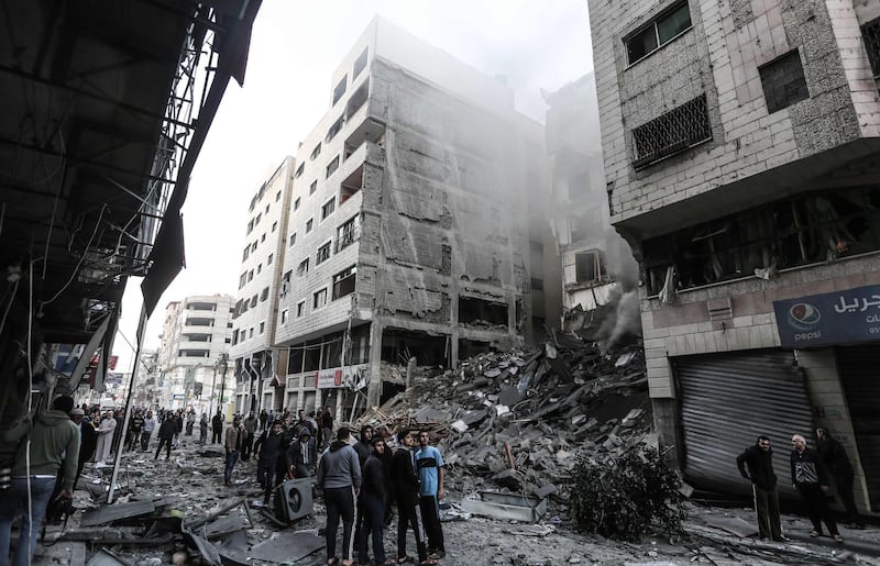 Palestinians check the damage in a neighbourhood in Gaza City. AFP Photo