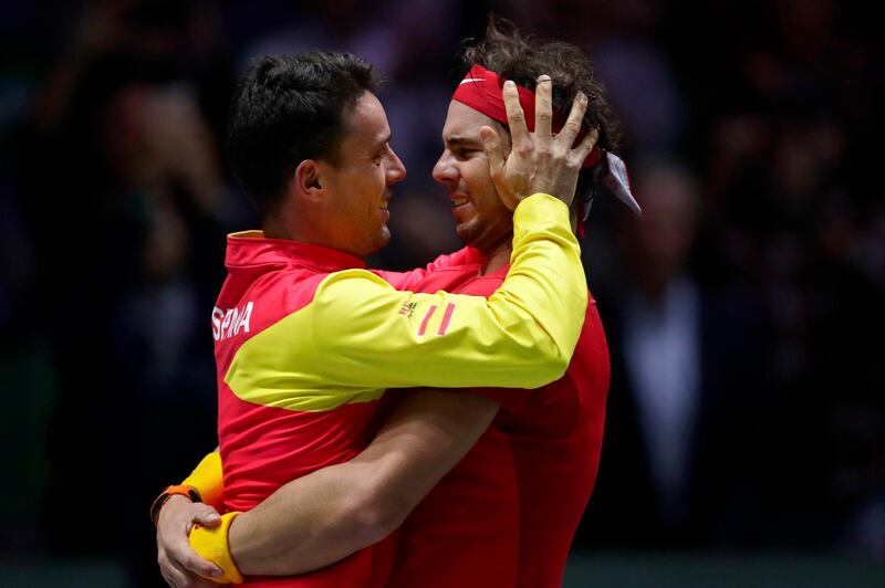 Rafael Nadal, right, celebrates with teammate Roberto Bautista Agut. AP