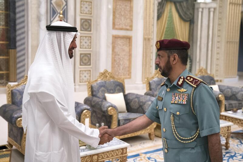 ABU DHABI, UNITED ARAB EMIRATES - May 20, 2018: HH Sheikh Mohamed bin Zayed Al Nahyan Crown Prince of Abu Dhabi Deputy Supreme Commander of the UAE Armed Forces (L), receives a member of the Abu Dhabi Police, during an iftar reception at the Presidential Palace. 

( Hamad Al Kaabi / Crown Prince Court - Abu Dhabi )
---