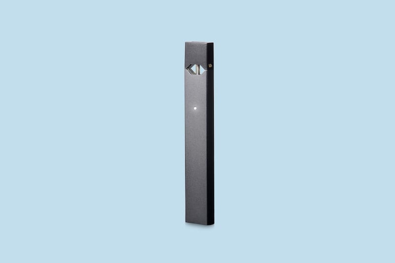 This image provided by Juul Labs on Tuesday, April 24, 2018 shows the company's e-cigarette device. On Tuesday, federal health officials announced a nationwide crackdown on underage use of a popular e-cigarette brand following months of complaints from parents, politicians and school administrators. Juul Labs says it monitors retailers to ensure they are following the law, and its age verification system searches public records and sometimes requires customers to upload a photo ID. (Courtesy of Juul Labs via AP)