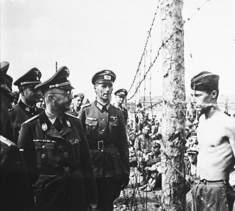 377234 21: UNDATED FILE PHOTO: Heinrich Himmler, front center in glasses, Reichsfuhrer-SS, head of the Gestapo and the Waffen-SS, Minister of the Interior from 1943 to 1945, inspects a prisoner-of-war camp in this undated file photo from 1940-41 in Russia. Himmler was the organizer of the mass murder of Jews in the Third Reich. (Courtesy of the National Archives/Newsmakers