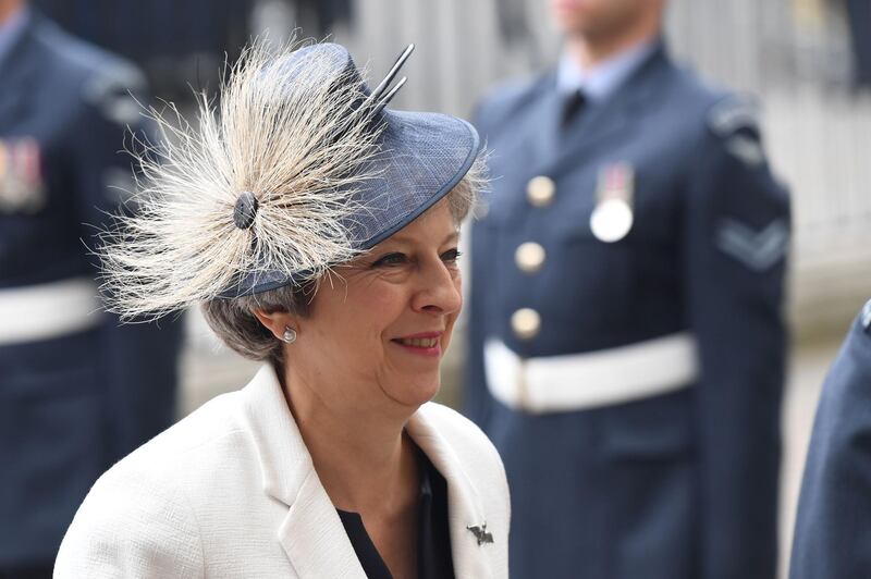 Britain's Prime Minister Theresa May arrives for a service to mark the centenary of the Royal Air Force (RAF) at Westminster Abbey in central London on July 10, 2018. / AFP / Chris J Ratcliffe
