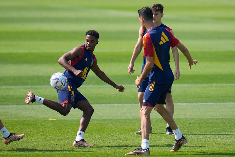 Spain Ansu Fati, left, controls the ball. AP Photo 