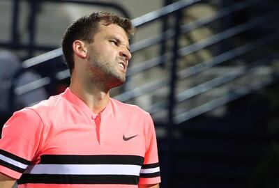 Grigor Dimitrov of Bulgaria reacts during his Dubai Duty Free Tennis singles match against Tunisia's Malek Jaziri (unseen) on February 27, 2018. / AFP PHOTO / KARIM SAHIB