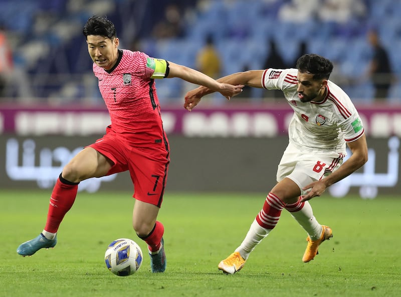 South Korea's Son Heung-min holds off the challenge of Majed Hassan of the UAE. Reuters