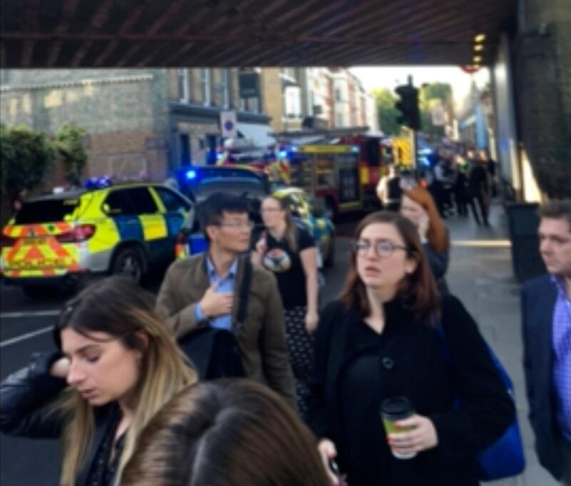 
                  People leave the scene of an explosion at a southwest London subway station in London Friday, Sept. 15, 2017. London's Metropolitan Police and ambulance services are confirming they are at the scene of "an incident" at the Parsons Green subway station in the southwest of the capital. The underground operator said services have been cut along the line. (@RRIGS via AP)
               