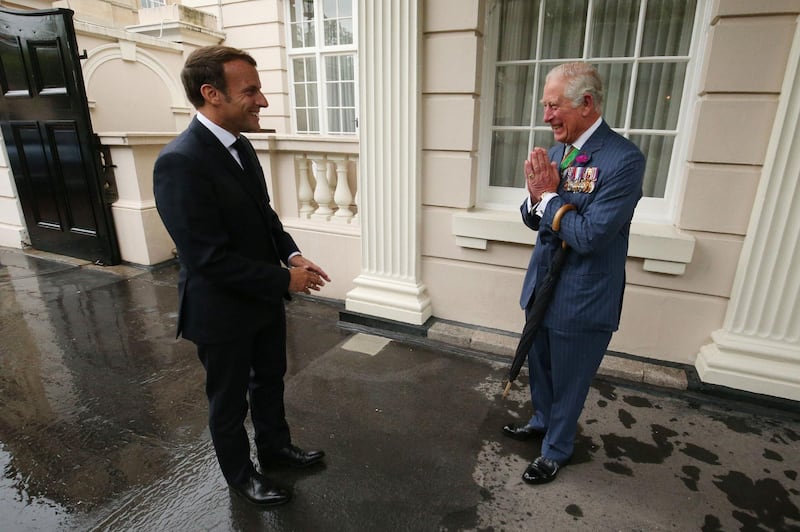 Britain's Prince Charles greets French President Emmanuel Macron at Clarence House in central London as he arrives for a visit to mark the 80th anniversary of former French president Charles de Gaulle's appeal to French people to resist the Nazi occupation during World War II. AFP
