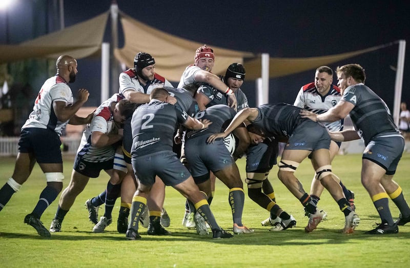 Dubai Hurricanes attempt to advance the ball during the final against Jebel Ali Dragons.