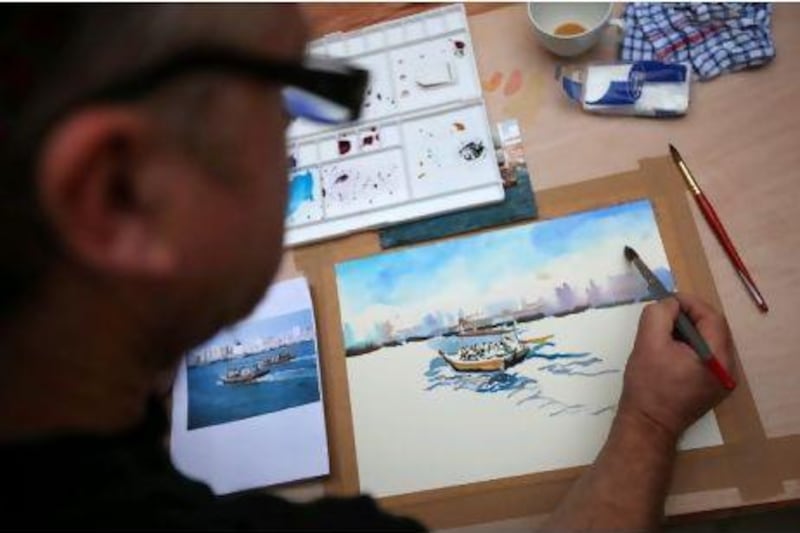 British artist Trevor Waugh teaches students how to paint in his "Exploring Watercolour" class at the Majlis Gallery in Dubai's Bastikya district.