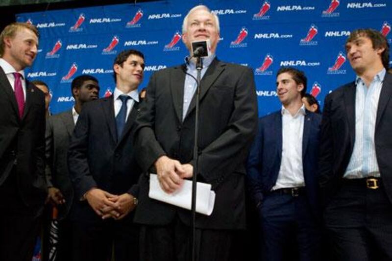 Donald Fehr, centre, of the NHL Players' Association is flanked by hockey stars as he speaks to the press following talks over a player lockout