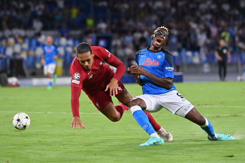 Liverpool's Virgil van Dijk fights for the ball with Napoli forward Victor Osimhen in the Champions League. AFP