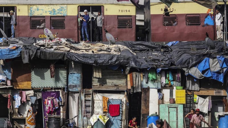 Large swathes of the world's population live in slums.    Dhiraj Singh / Bloomberg