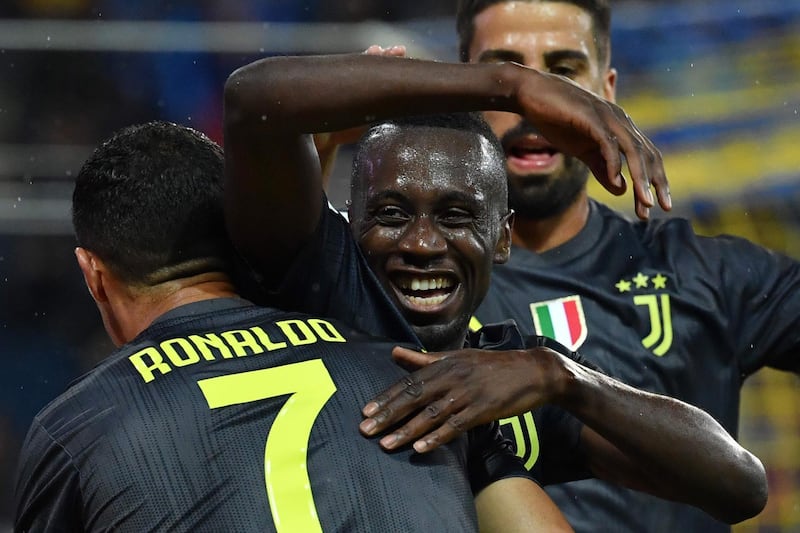 Blaise Matuidi celebrates with Cristiano Ronaldo after scoring the winning goal for Juventus. AFP