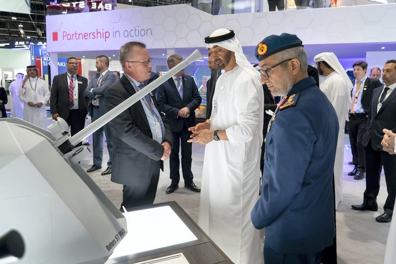 ABU DHABI, UNITED ARAB EMIRATES - February 17, 2019: HH Sheikh Mohamed bin Zayed Al Nahyan, Crown Prince of Abu Dhabi and Deputy Supreme Commander of the UAE Armed Forces (2nd R) tours the 2019 International Defence Exhibition and Conference (IDEX), at Abu Dhabi National Exhibition Centre (ADNEC). Seen with HE Major General Essa Saif Al Mazrouei, Deputy Chief of Staff of the UAE Armed Forces (R).
( Rashed Al Mansoori / Ministry of Presidential Affairs )
---
