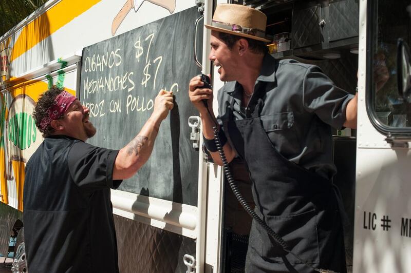 Jon Favreau, left, and John Leguizamo in a scene from Chef. Merrick Morton, Open Road Films / AP photo