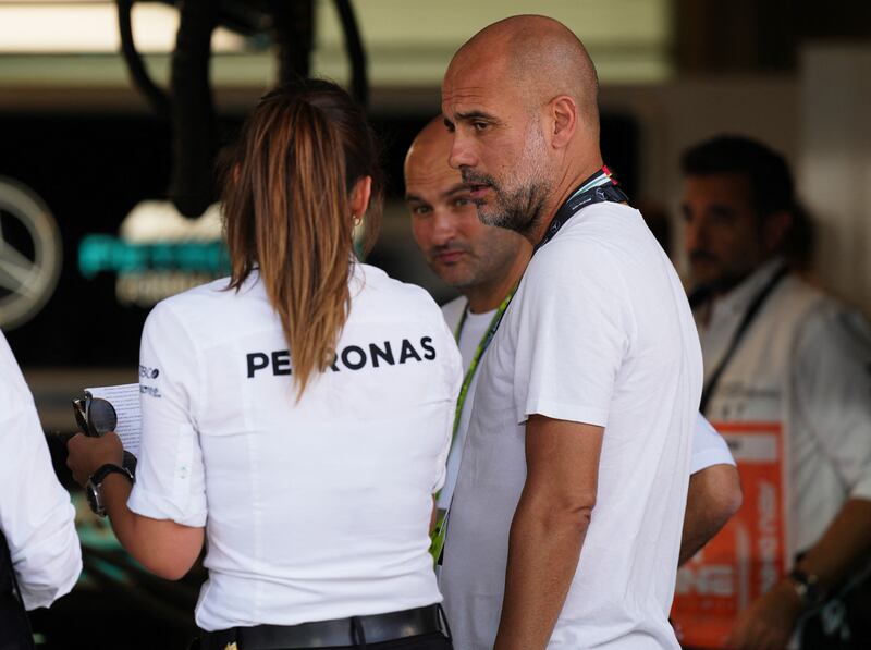 Manchester City manager Pep Guardiola at the Mercedes garage. Reuters