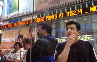 N366994 05: A passer-by looks over the prices on the Nasdaq board in Times Square in New York, April 3, 2000. The Nasdaq plummeted 349 points to 4225.25 Monday, the fifth-biggest one-day loss in percentage terms in its history. Microsoft shares plummeted on news that attempts to settle the U.S. federal government's antitrust lawsuit broke down over the weekend. (Photo by Chris Hondros)
