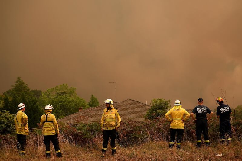 New South Wales Rural Fire Service officers watch as the Grose Valley Fire approaches Kurrajong Heights, NSW.  EPA