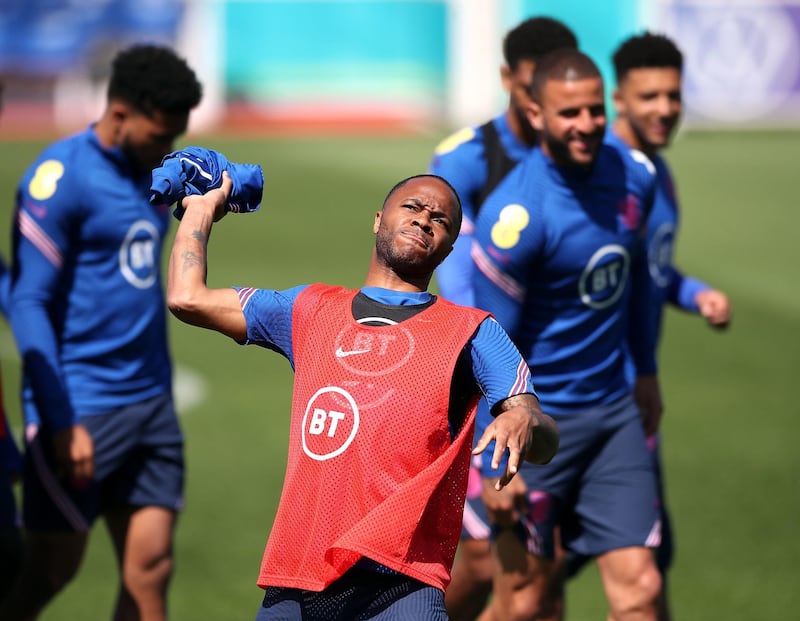 England’s Raheem Sterling throws a training top during training ahead of their Euro 2020 match against Scotland. PA