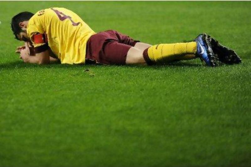 Cesc Fabregas, the Arsenal captain, lies on the pitch in Braga during Tuesday’s Champions League defeat. The hamstring he injured will keep him out of action for at least two weeks.