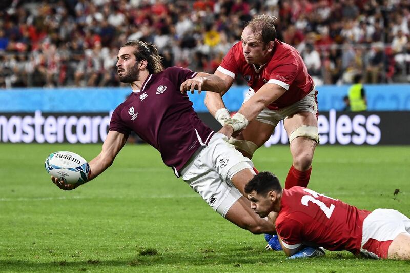 Georgia winger Miriani Modebadze lays the ball off under pressure from Tomos Williams and Alun Wyn Jones on Monday. AFP