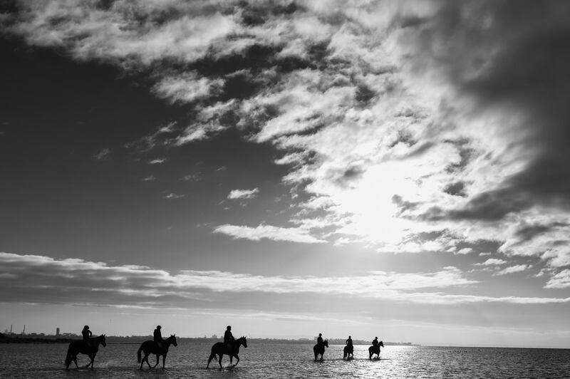 The Mcevoy Mitchell Racing team rides during a beach session at Altona beach in Melbourne, Australia. Getty Images