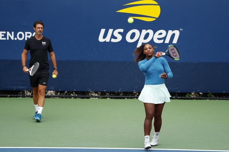 FILE - In this Aug. 31, 2018, file photo, Serena Williams walks on a practice court with her coach, Patrick Mouratoglou, during the third round of the U.S. Open tennis tournament,  in New York. Serena Williams' coach says in-match coaching should be allowed in tennis to help the sport's popularity. Mouratoglou, who admitted he used banned hand signals to try to help Williams during her loss in the U.S. Open final, wrote Thursday, Oct. 18, 2018, in a posting on Twitter that legalizing coaching and making it part of the spectacle would let "viewers enjoy it as a show."(AP Photo/Adam Hunger, File)