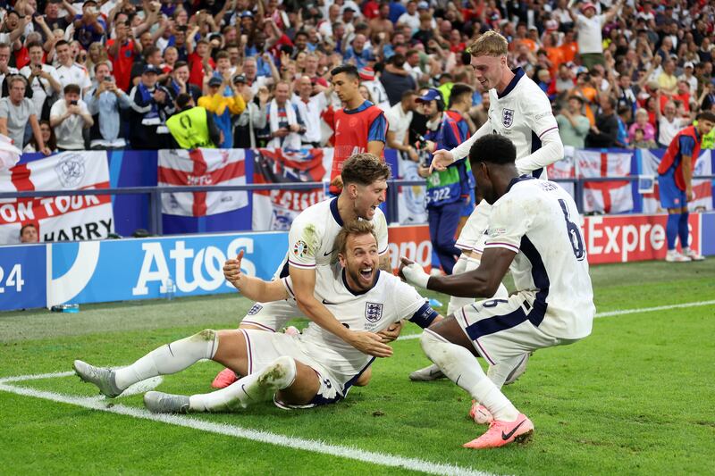 Harry Kane of England celebrates scoring his team's second goal with teammates. Getty Images