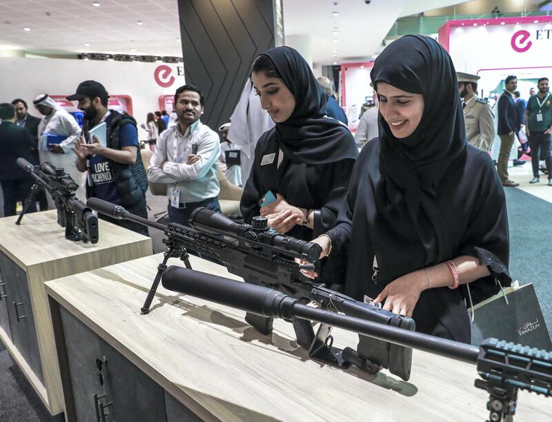 Abu Dhabi, U.A.E., February 20, 2019. INTERNATIONAL DEFENCE EXHIBITION AND CONFERENCE  2019 (IDEX) Day 4--  Colour images.-- Visitors at the show look at some Caracal firearms.Victor Besa/The NationalSection:  NA