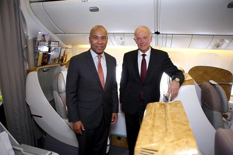 Emirates Airline president Timothy Clark, right, gives Massachusetts governor Deval Patrick a tour of the Boeing 777. Courtesy Emirates Airline