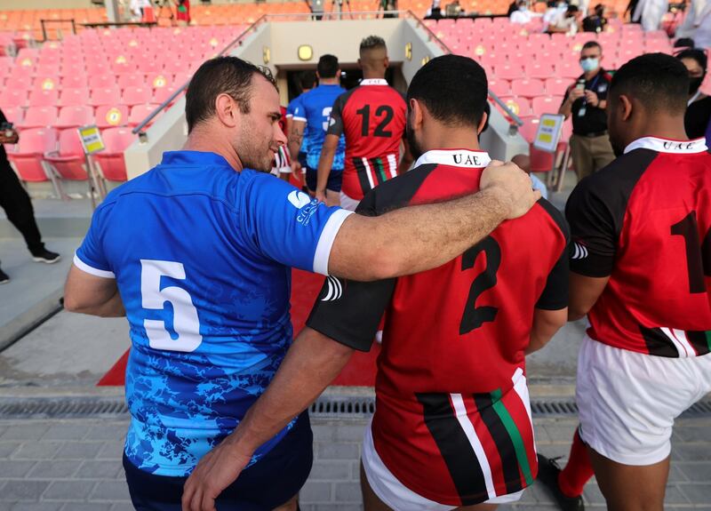 UAE and Israel players embrace after their match in Dubai on Friday. Reuters