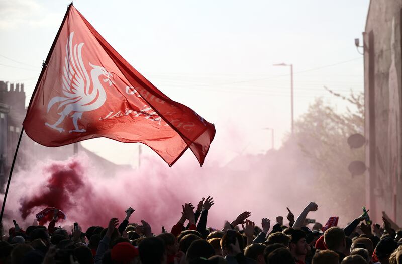 Liverpool fans with flares outside the stadium. Reuters