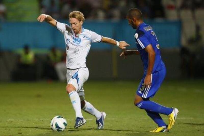 Christian Wilhelmsson of Baniyas, left, has missed pre-season training on last two occasions. Jake Badger for The National