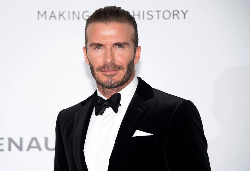 FILE - In this May 25, 2017 file photo, soccer legend David Beckham poses for photographers upon arrival at the amfAR charity gala during the Cannes 70th international film festival, Cap d'Antibes, southern France. Beckham, who is married to fashion mogul Victoria Beckham, will launch 21 menâ€™s grooming products under the name House 99 on Feb. 1 in the United Kingdom, exclusively at Harvey Nichols stores.  (Photo by Arthur Mola/Invision/AP, File)