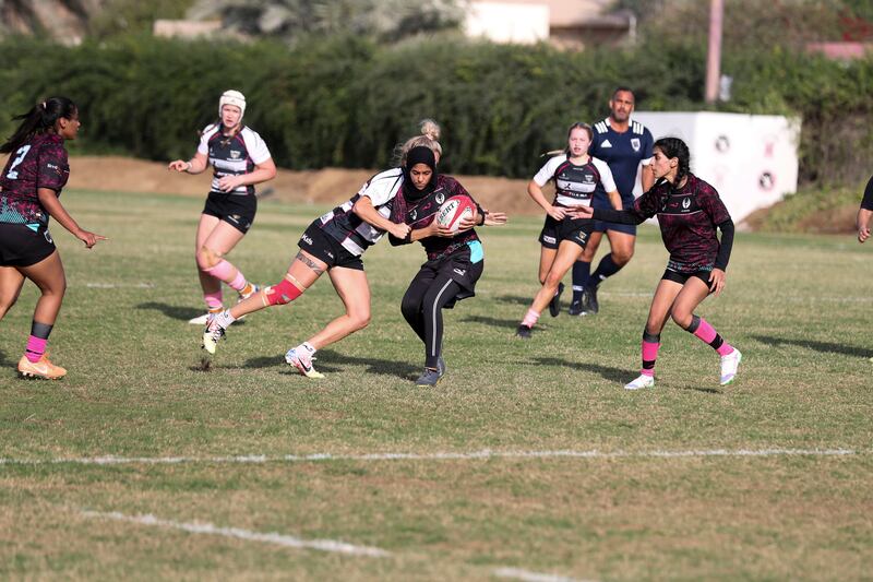 Al Maha on the attack against Dubai Falcons in the UAE women's rugby sevens in Sharjah. Khushnum Bhandari / The National
