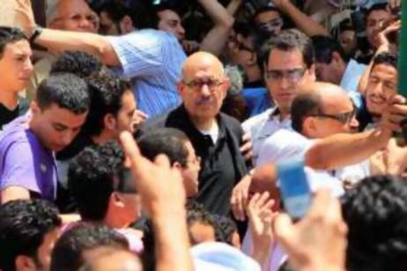 Egyptian Nobel Peace laureate and former UN atomic watchdog chief Mohamed ElBaradei attends a demonstration after Friday prayers in Alexandria June 25, 2010, against the death of Egyptian alleged victim of torture Khaled Said by the police earlier this month, in the port city of Alexandria. AFP PHOTO/KHALED DESOUKI *** Local Caption ***  868075-01-08.jpg
