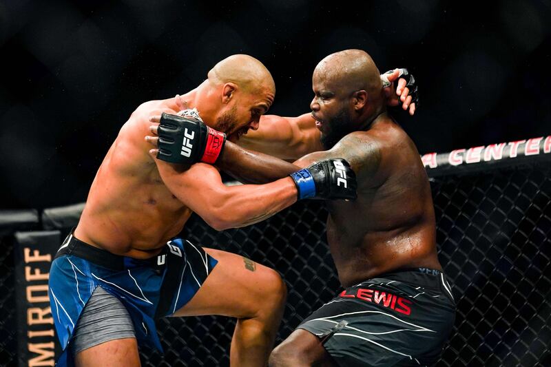 Derrick Lewis and Ciryl Gane grapple during their Heavyweight bout at Toyota Center. AFP